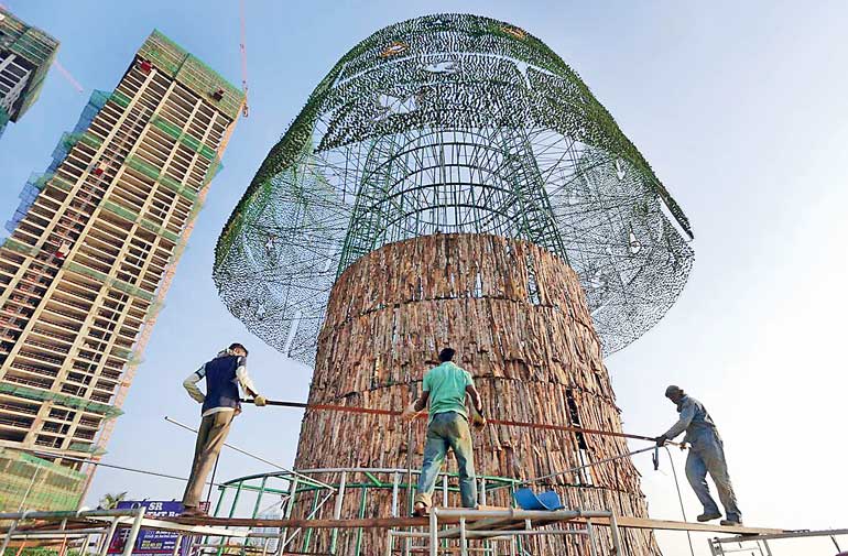 workers in mid december used steel rods in the construction of what aims to be a record breaking artificial christmas tree in colombo photo eranga - Worlds Tallest Christmas Tree workers in mid december used steel rods in the construction of what aims to be a record breaking artificial christmas tree in colombo photo eranga - Worlds Tallest Christmas Tree